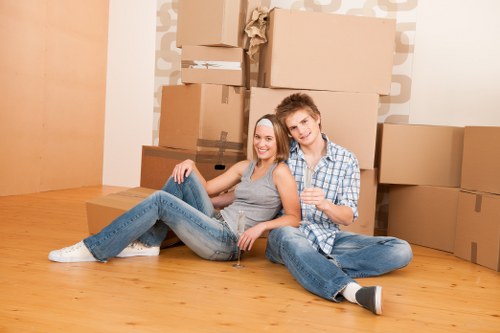 Removal van and moving boxes prepared for a flat move in Teddington