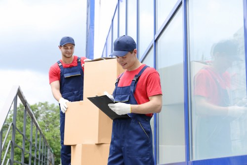 Professional movers handling belongings in a Teddington property