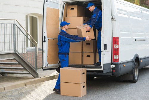 Loading boxes and furniture into a van for a local move in Teddington