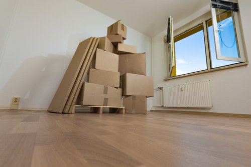 Packed boxes and furniture ready for local flat removals in Teddington
