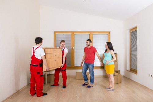 Moving team protecting items with safety equipment during a Teddington van relocation
