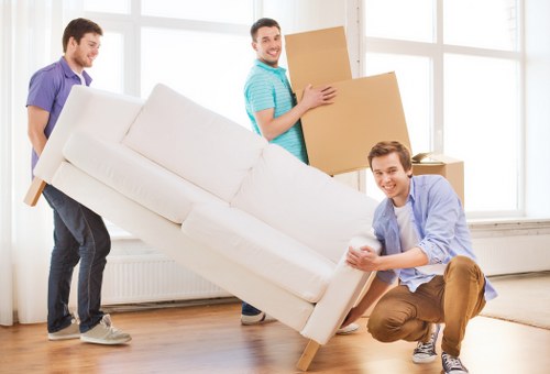 Careful loading of student belongings for a move in Teddington