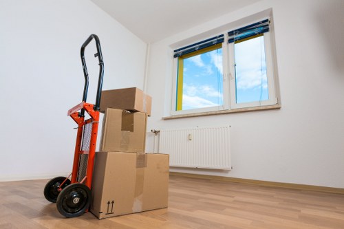 Moving team handling household furniture and boxes in Teddington